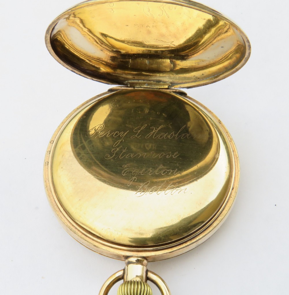 An open-face antique gold-tone pocket watch with a white enamel dial, black Roman numerals, and a secondary seconds dial at the bottom. View III