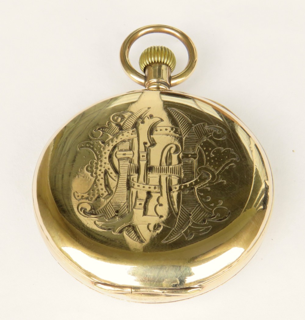 An open-face antique gold-tone pocket watch with a white enamel dial, black Roman numerals, and a secondary seconds dial at the bottom. View IV