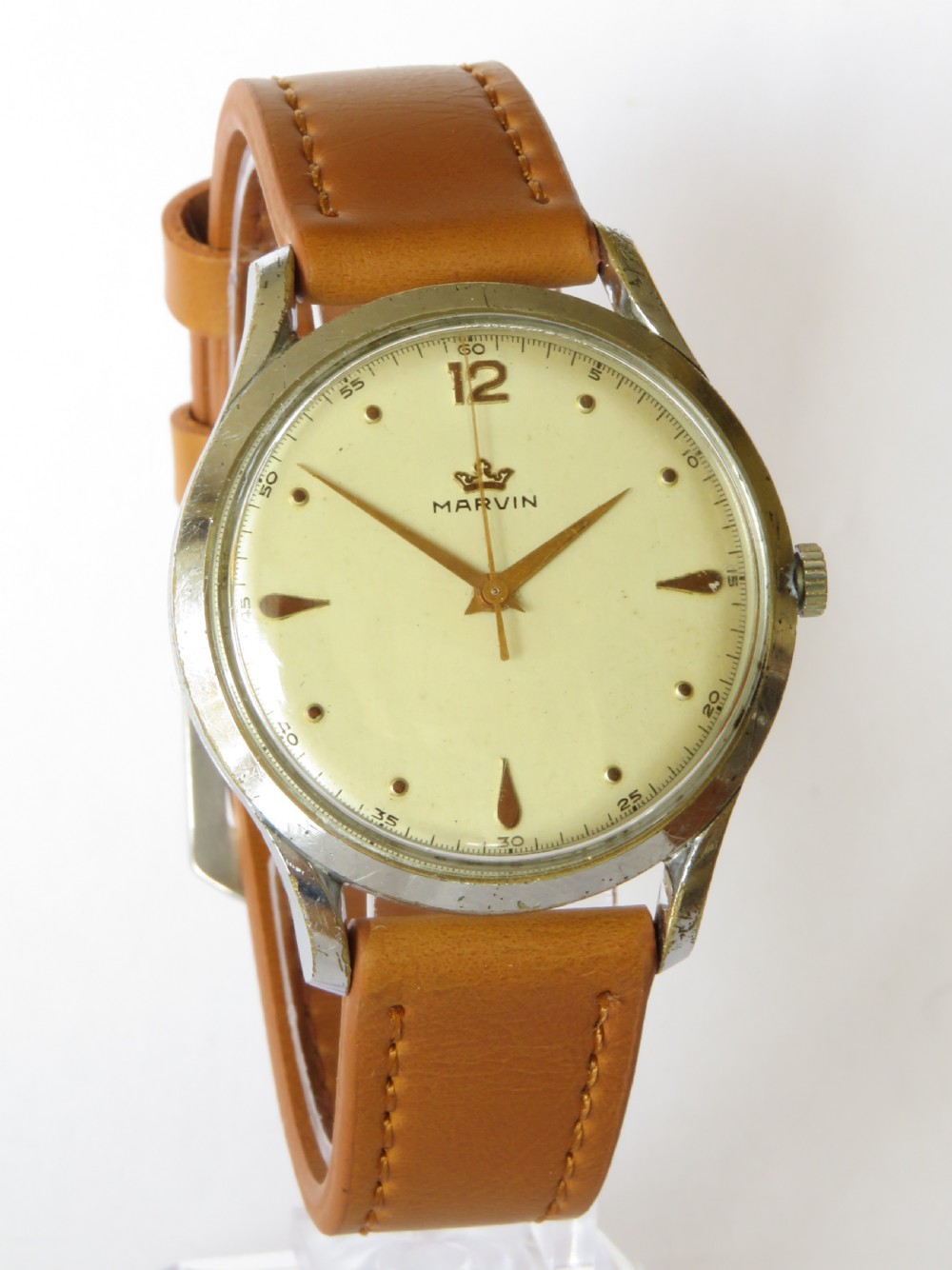 A vintage 1950s Marvin gents wristwatch featuring a cream dial with gold-tone markers and a tan leather strap. View II