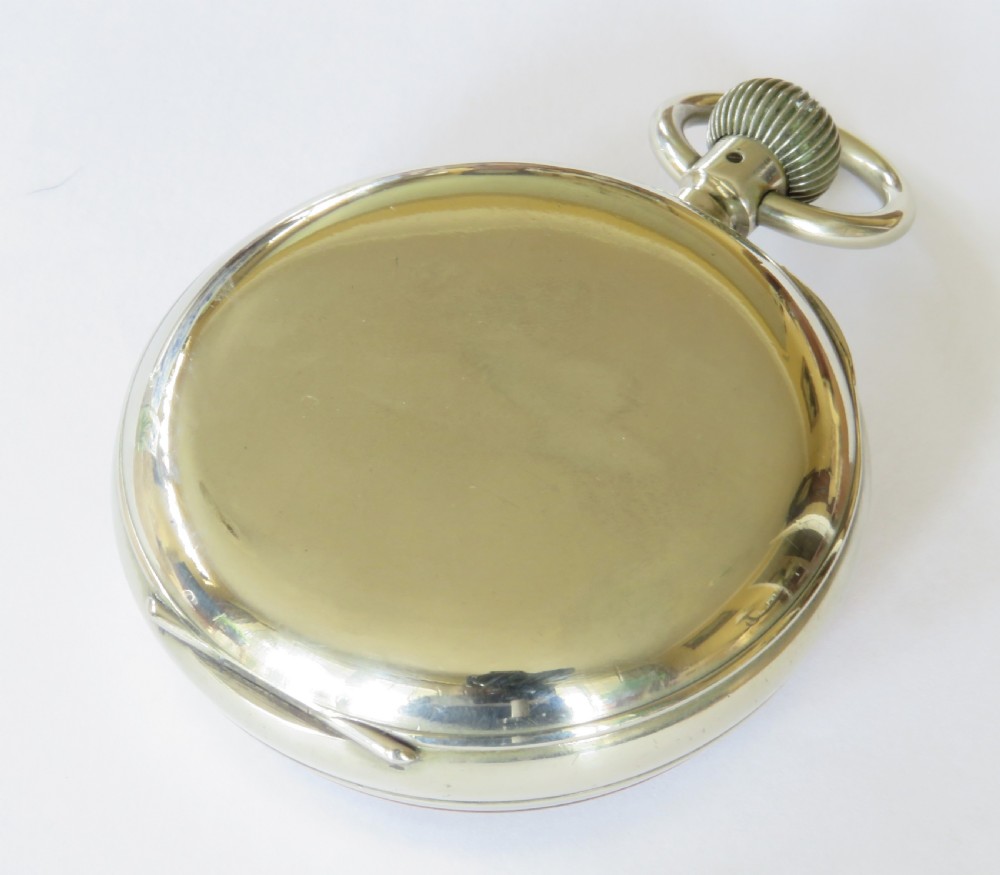 An antique goliath pocket watch featuring a white enamel dial with black Roman numerals, a sub-seconds dial, an onion crown, and a metallic case with a gilded inner bezel. View VI