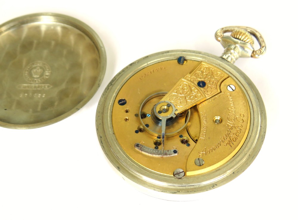 An open-face Edwardian pocket watch featuring a white enamel dial with black Arabic numerals, a subsidiary seconds dial, and a silver-toned metal case. View III