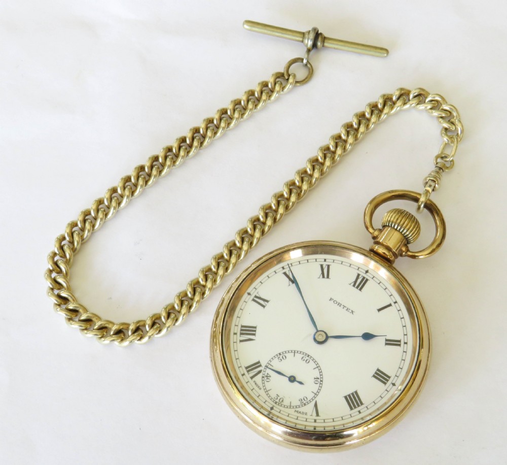A gold-toned open-face pocket watch with a white dial, black Roman numerals, subsidiary seconds sub-dial, and an attached curb chain. View III