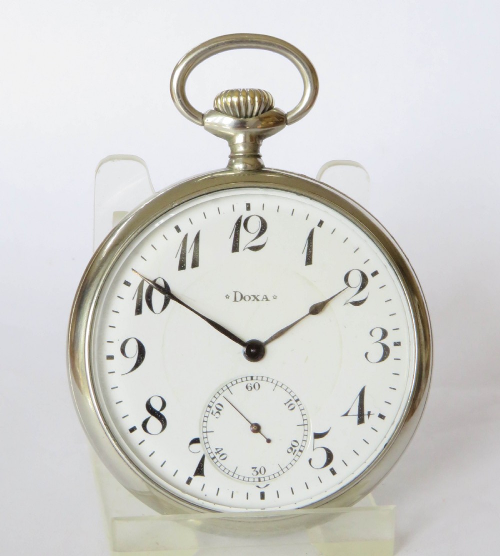 An open-face antique pocket watch featuring a white enamel dial with black Arabic numerals, a sub-seconds dial, and a polished silver-toned casing. View III