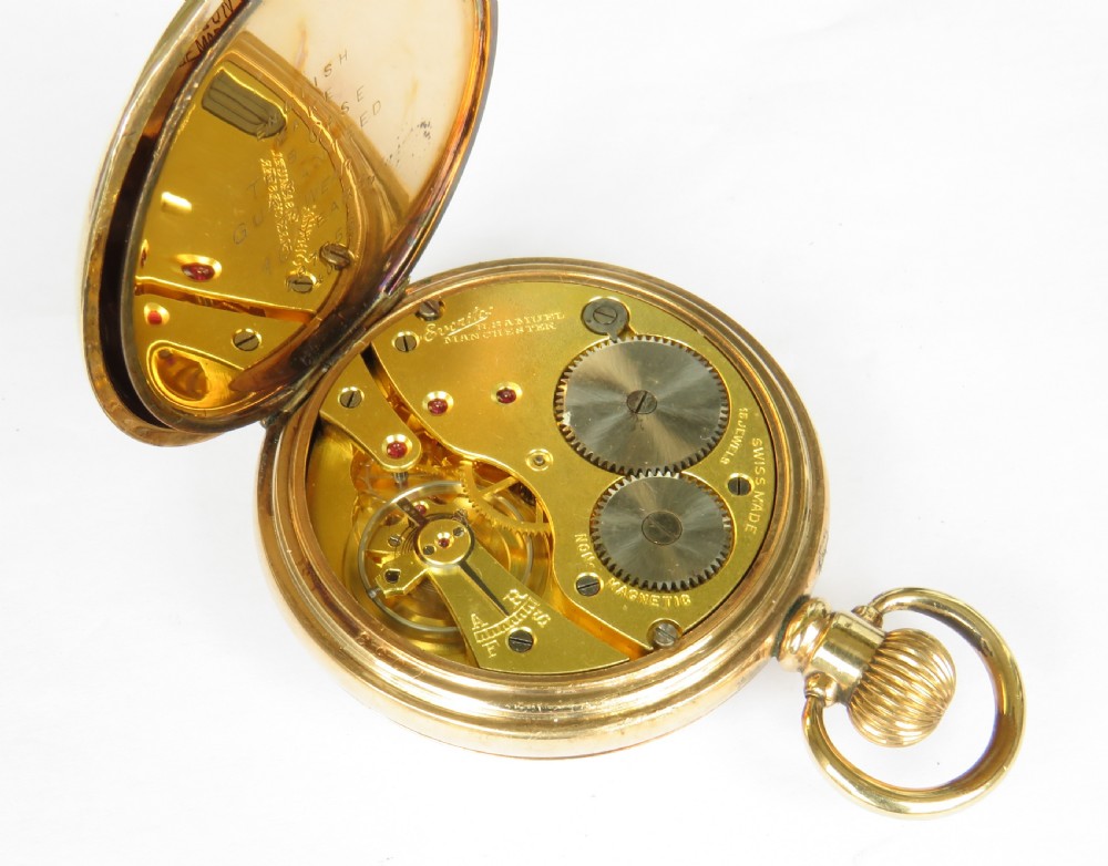 A 1930s gold-toned open-face pocket watch displaying a white dial with black Arabic numerals and a sub-seconds dial at six oclock. View IV