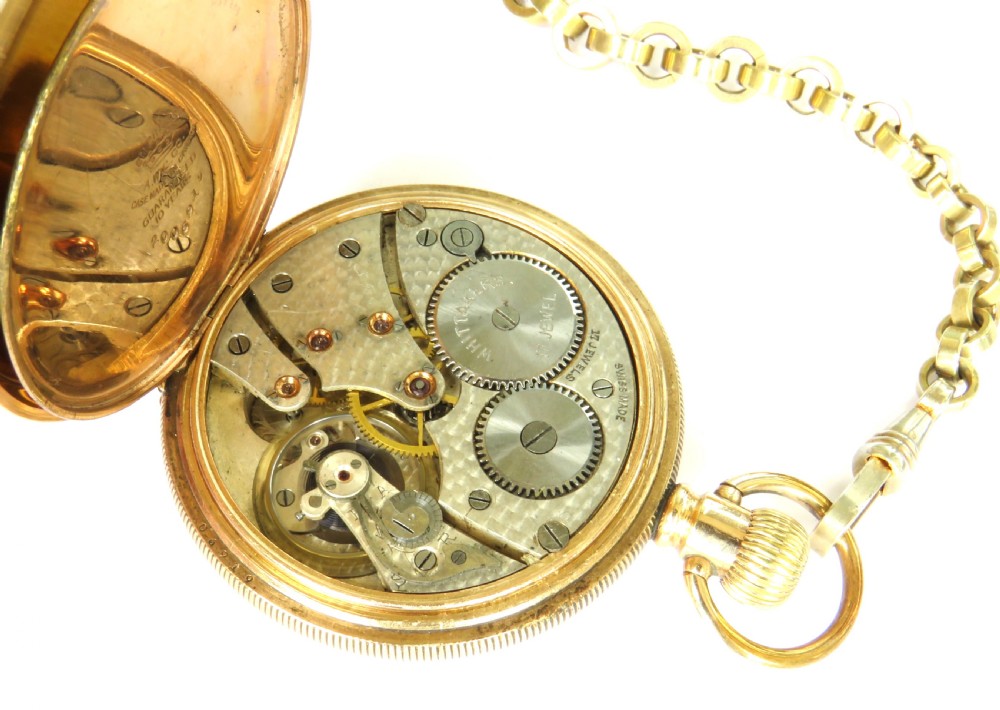 A 1930s gold-tone open-face pocket watch with a white dial, Roman numerals, a sub-seconds dial, and a linked Albert chain with a T-bar. View IV