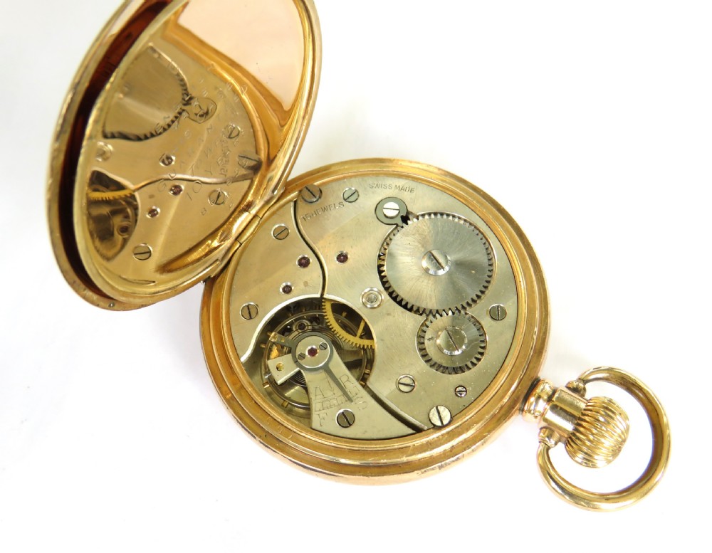 A gold-plated open-face pocket watch featuring a white enamel dial with black Roman numerals and a small seconds sub-dial at six oclock. View IV
