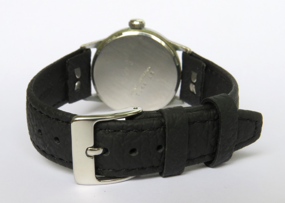 A 1940s Roamer gents wristwatch featuring a round black dial with Arabic numerals, a sub-second dial at six oclock, a chrome-plated case, and a textured black leather strap. View IV