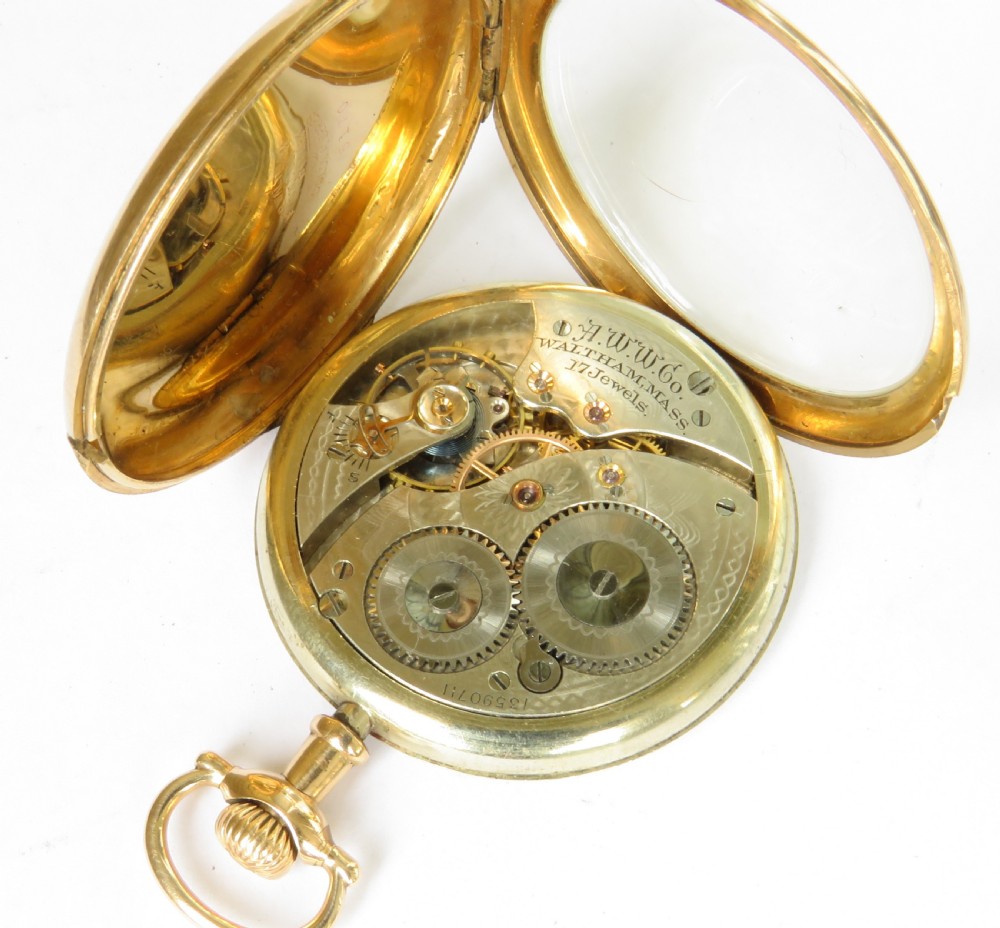 An Edwardian open-face pocket watch featuring a gold-toned casing, dark Arabic numerals, an engine-turned dial centre, and a lower sub-seconds dial. View III