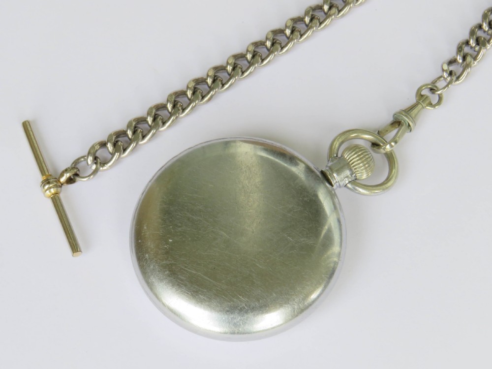 A 1930s Cyma open-face pocket watch featuring a white dial, black Arabic numerals, a sub-seconds dial, and a silver-toned curb chain with a T-bar. View IV