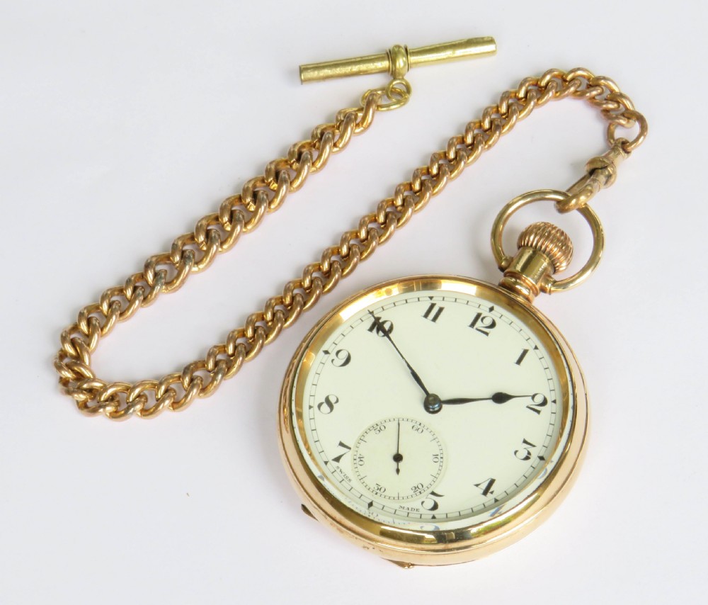 A gold-toned 1930s Cyma stem-winding pocket watch with a white enamel dial, black Arabic numerals, and a curb-link Albert chain with a T-bar. View II