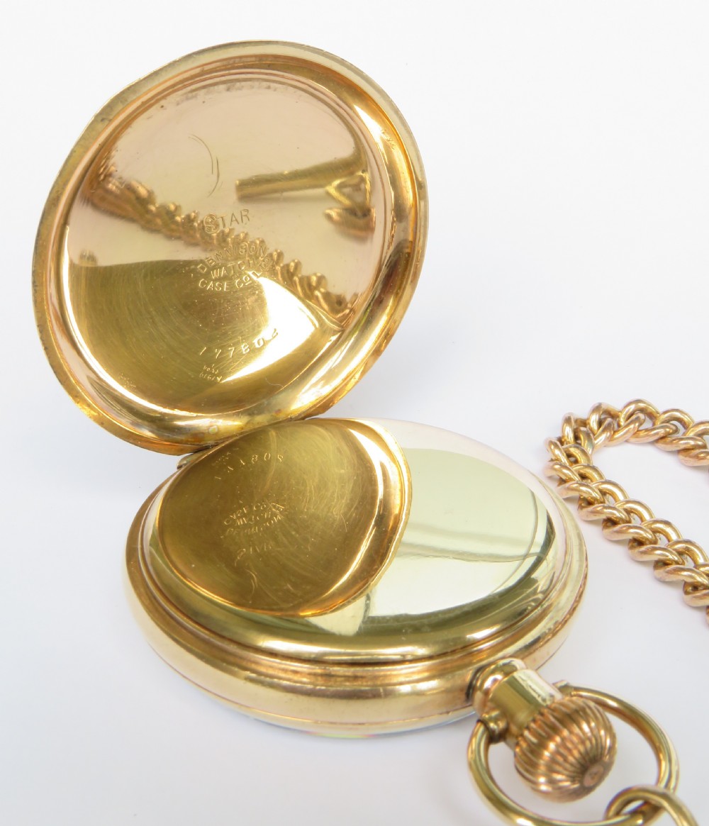 A gold-toned 1930s Cyma stem-winding pocket watch with a white enamel dial, black Arabic numerals, and a curb-link Albert chain with a T-bar. View III