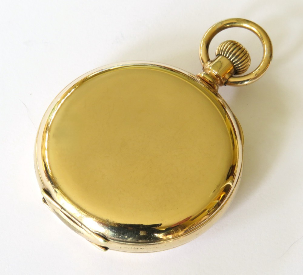 An open antique gold full hunter pocket watch with a white enamel dial, black Roman numerals, and a subsidiary seconds sub-dial. View V