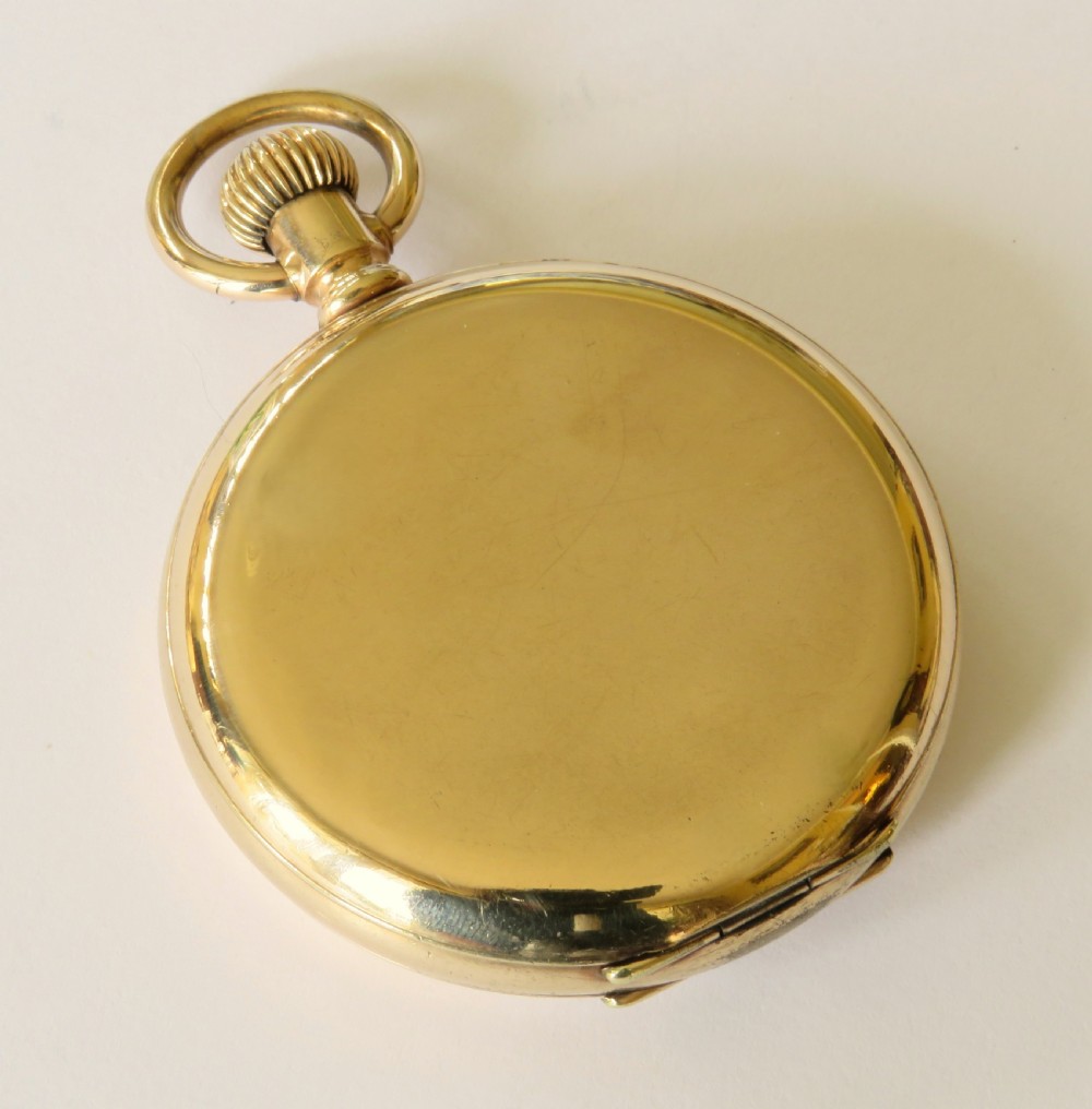 An open antique gold full hunter pocket watch with a white enamel dial, black Roman numerals, and a subsidiary seconds sub-dial. View VI