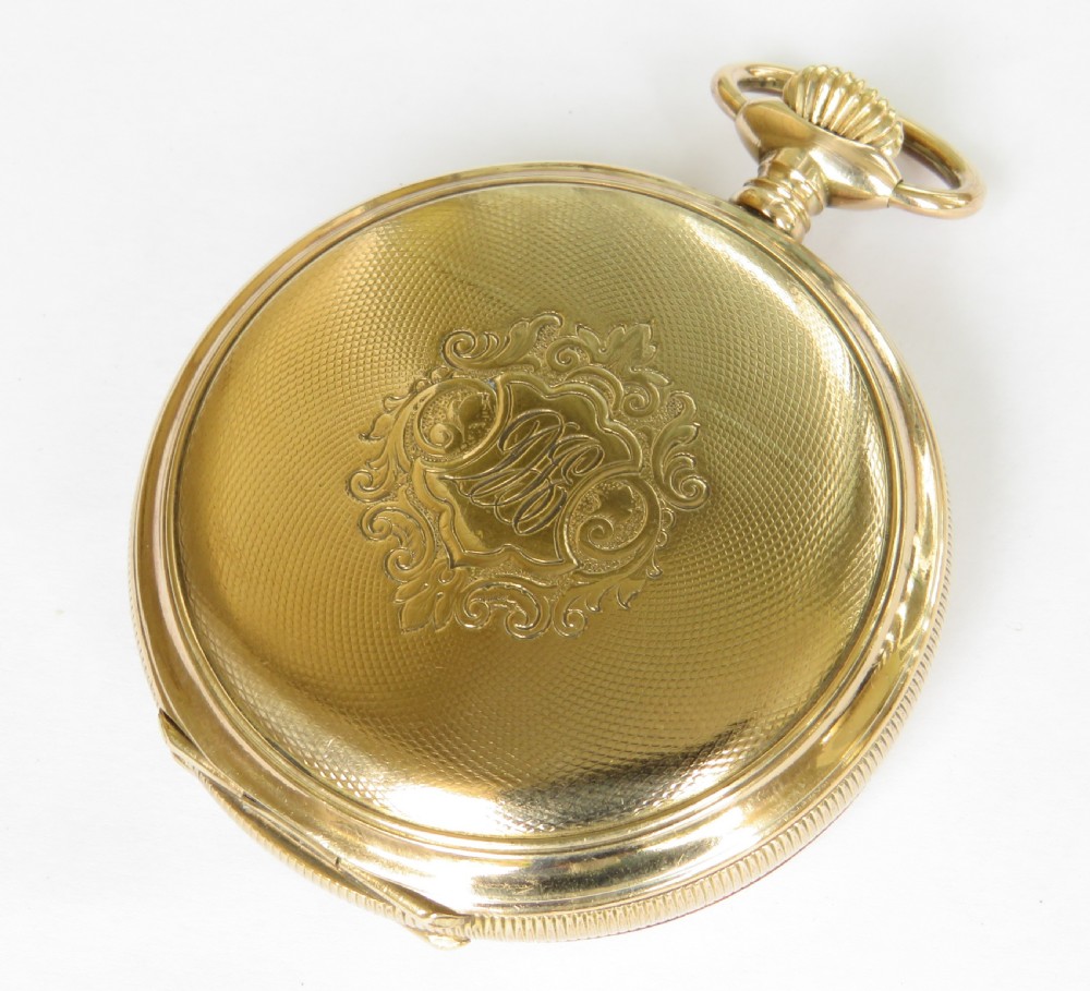 An open full hunter pocket watch featuring a gold case, a cream enamel dial with red Roman numeral cartouches, and an exposed balance bridge. View III
