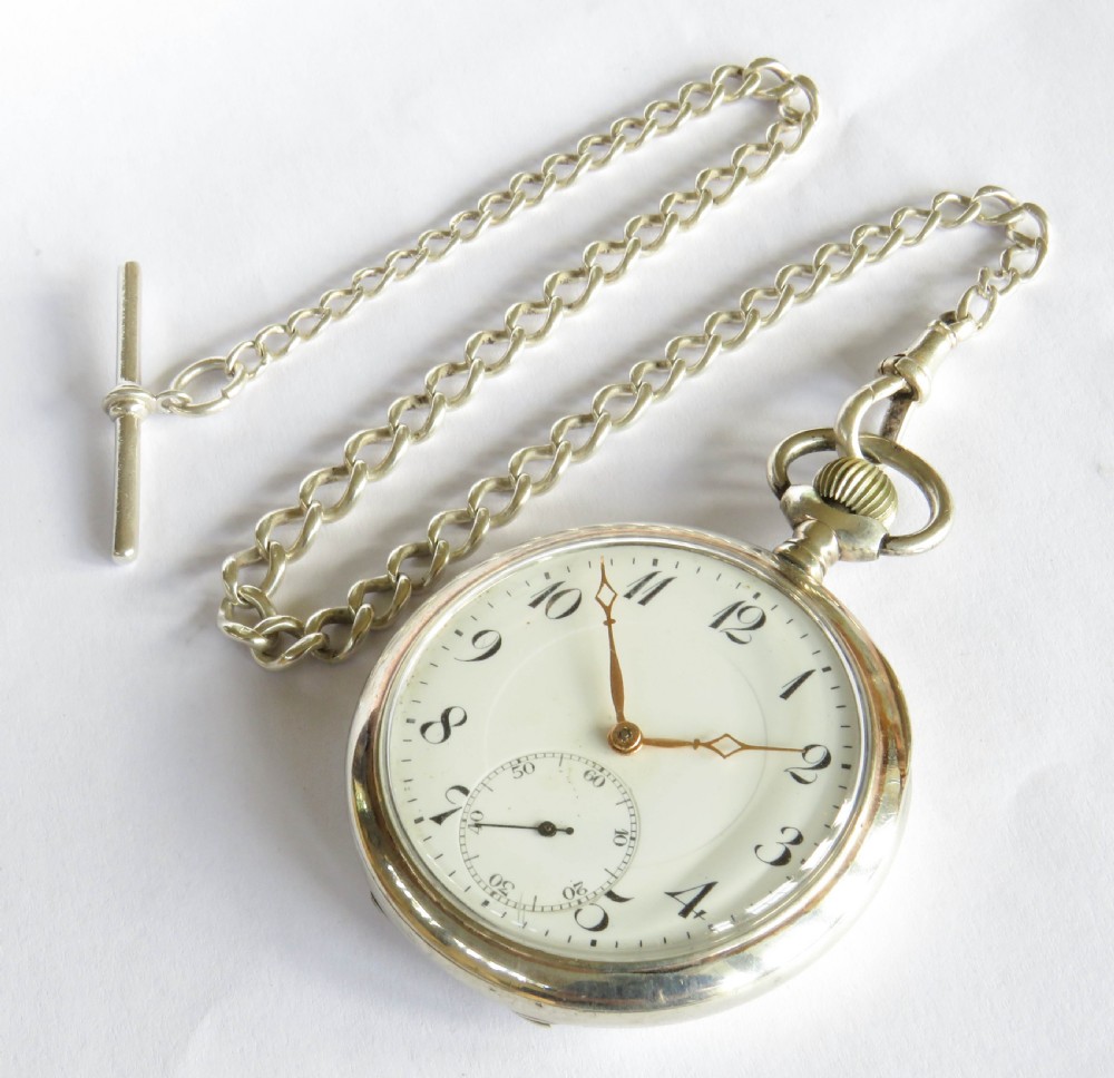 An Edwardian open-face silver pocket watch with a white enamel dial, Arabic numerals, a sub-seconds dial, and an attached silver T-bar chain. View II