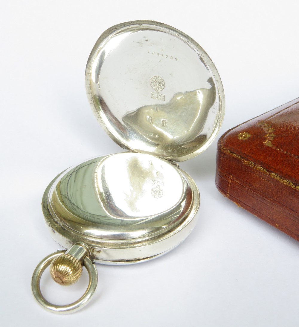 An antique silver open-face pocket watch featuring a white enamel dial with black Roman numerals and a sub-seconds dial. View III