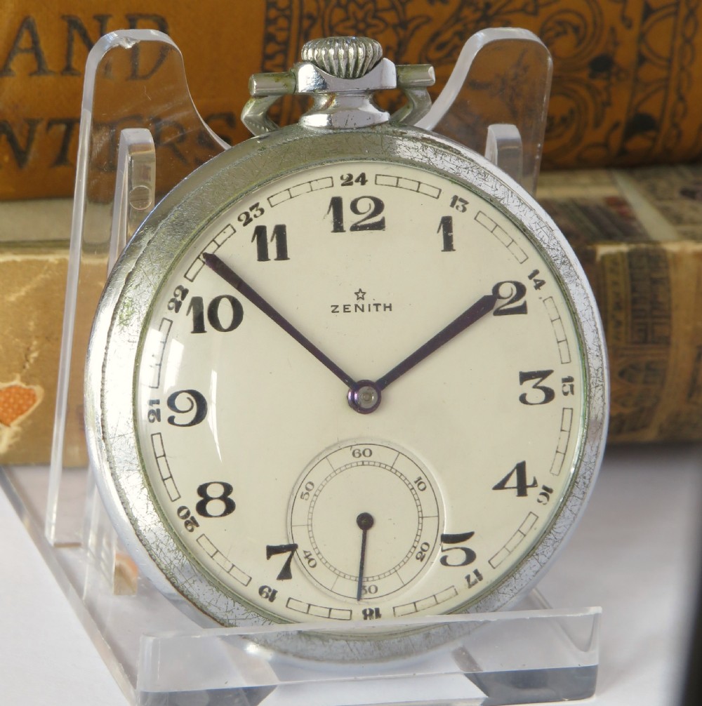 An open-face 1930s Zenith pocket watch featuring a cream dial, black Arabic numerals, a sub-seconds dial, and a silver-tone metal case. View II