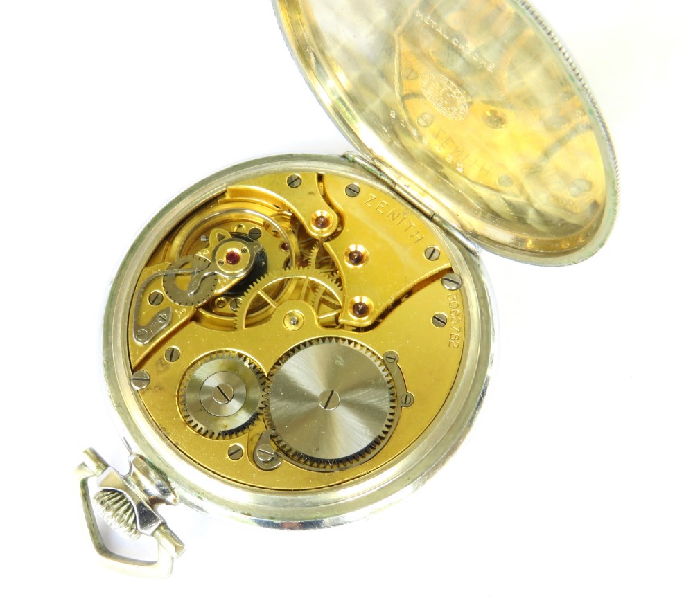 An open-face 1930s Zenith pocket watch featuring a cream dial, black Arabic numerals, a sub-seconds dial, and a silver-tone metal case. View III