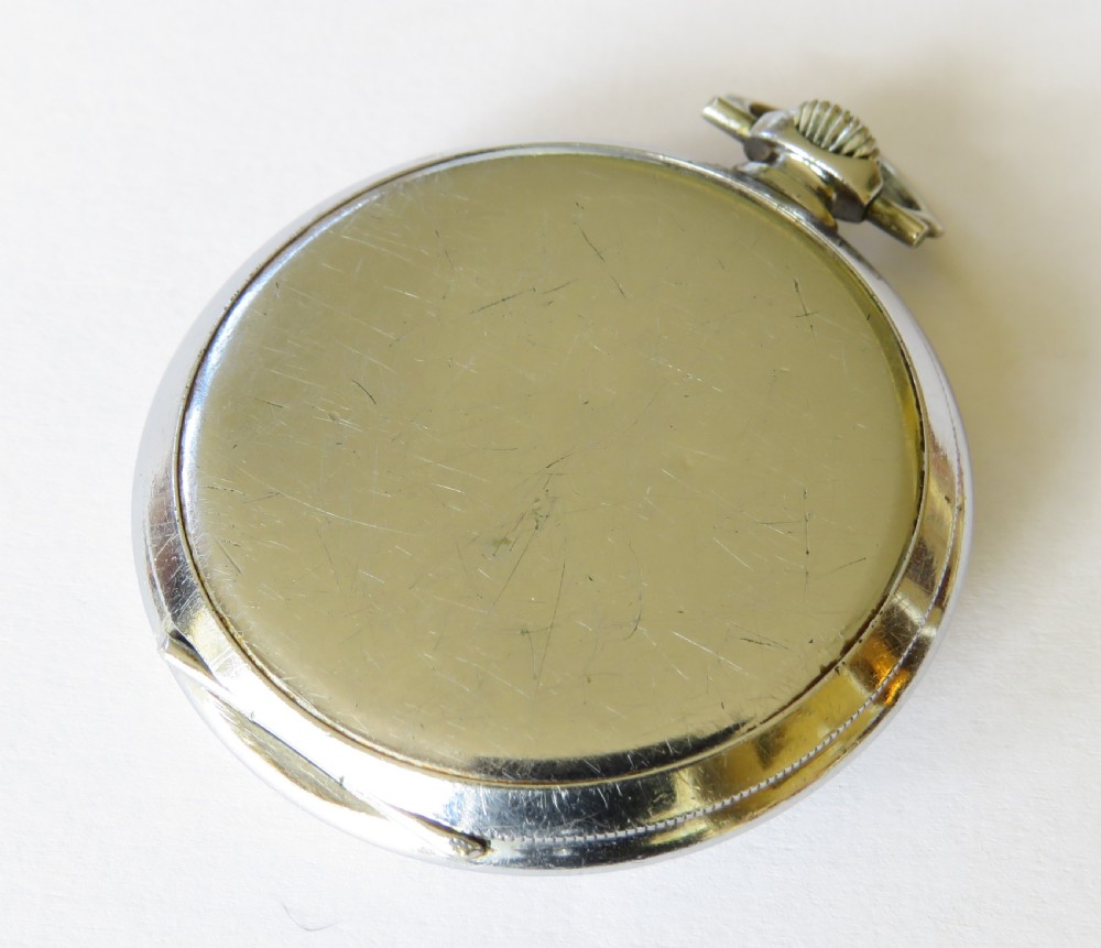 An open-face 1930s Zenith pocket watch featuring a cream dial, black Arabic numerals, a sub-seconds dial, and a silver-tone metal case. View IV