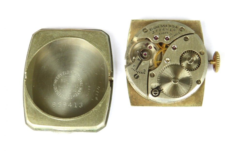 A 1948 Elgin mens wristwatch featuring a rectangular gold-toned case, cream dial with gold Arabic numerals, sub-seconds dial, and tan leather strap. View IV