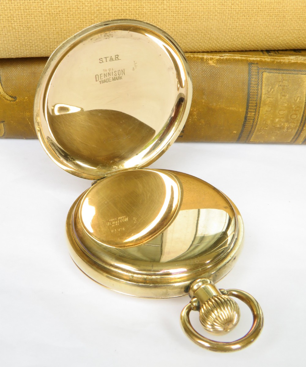 A gold-toned half hunter pocket watch featuring an open front case, white enamel dial with Roman numerals, and a sub-seconds dial. View III