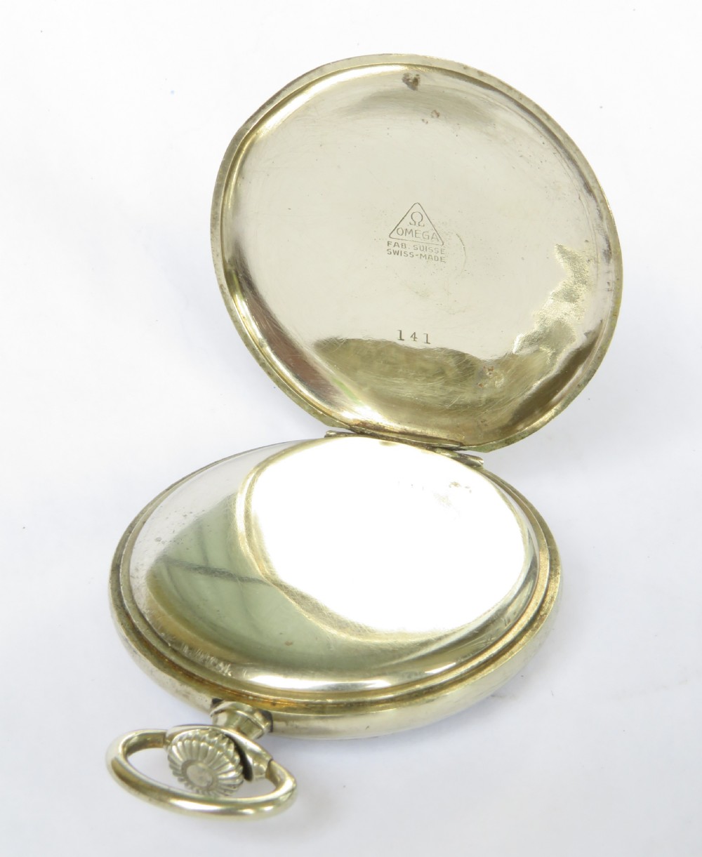 A 1943 open-face Omega pocket watch featuring a white enamel dial, black Arabic numerals, a sub-seconds dial, and a silver-toned metal case. View III