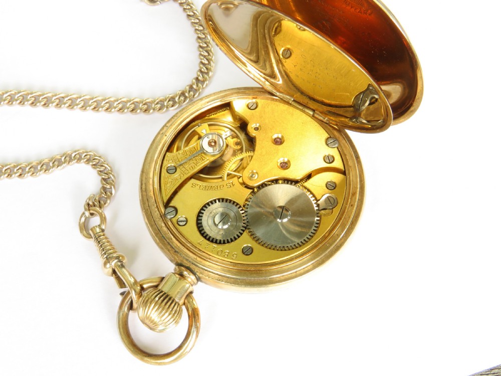A 1930s Swiss open-faced pocket watch featuring a white enamel dial with black Roman numerals, a subsidiary seconds dial, and a matching gold-toned curb chain with a T-bar. View III