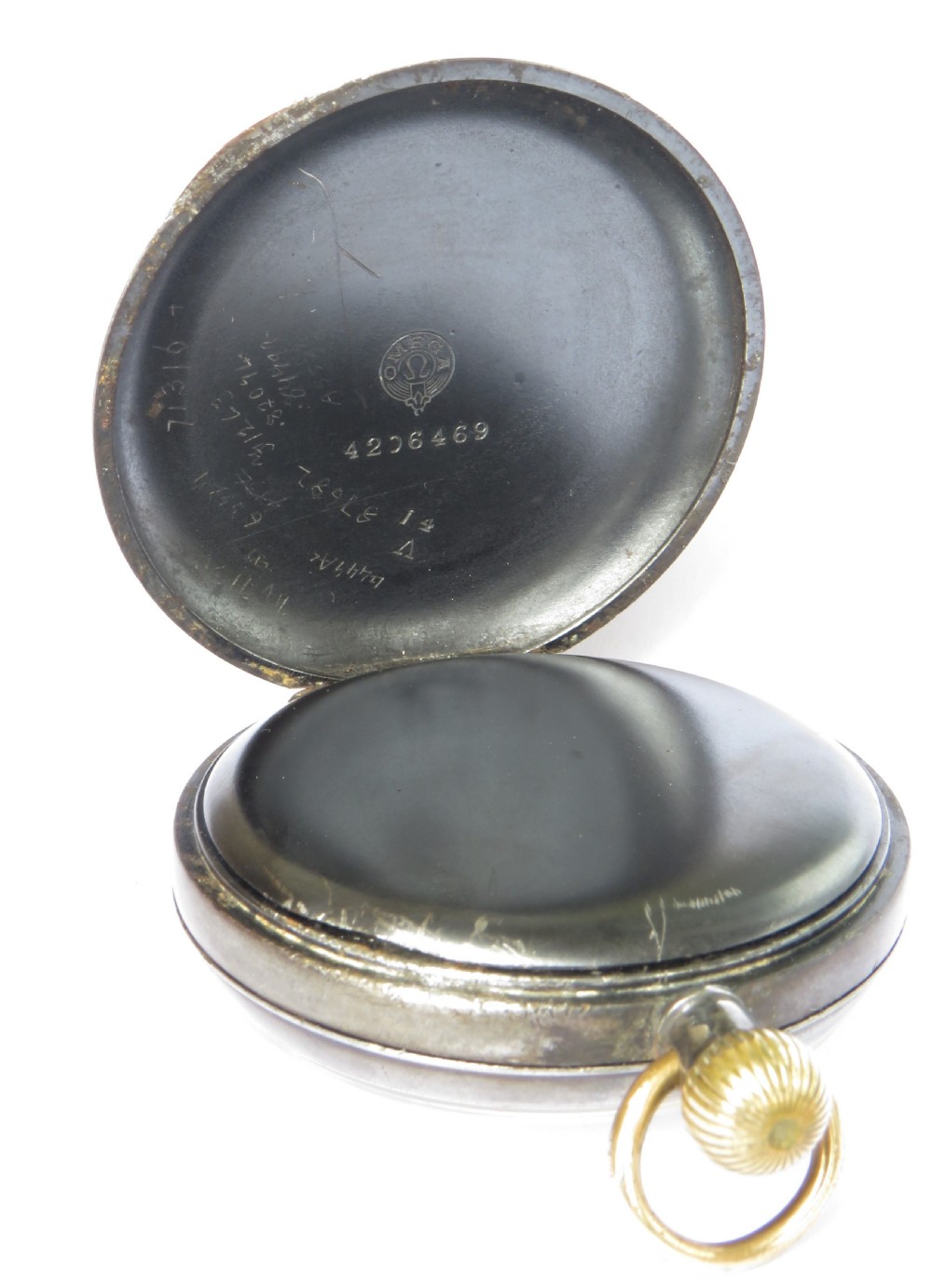 An antique open-face gunmetal pocket watch with a white enamel Roman numeral dial and brass Albert chain, set inside a red presentation case. View V