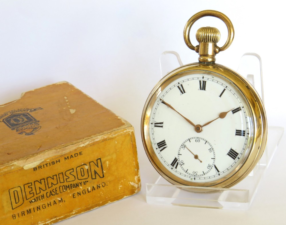 A 1940s gold-plated open-face pocket watch featuring a white dial with Roman numerals alongside its original cardboard Dennison presentation box.