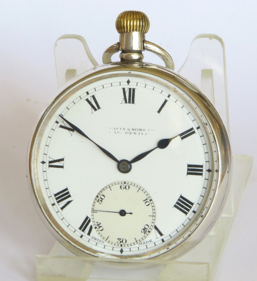 A 1930s silver open-face pocket watch with a white enamel dial, black Roman numerals, spade hands, and a subsidiary seconds dial. View III