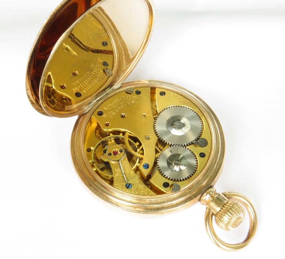 An open-face gold pocket watch featuring a white enamel dial, black Roman numerals, and a subsidiary seconds dial at six oclock. View IV