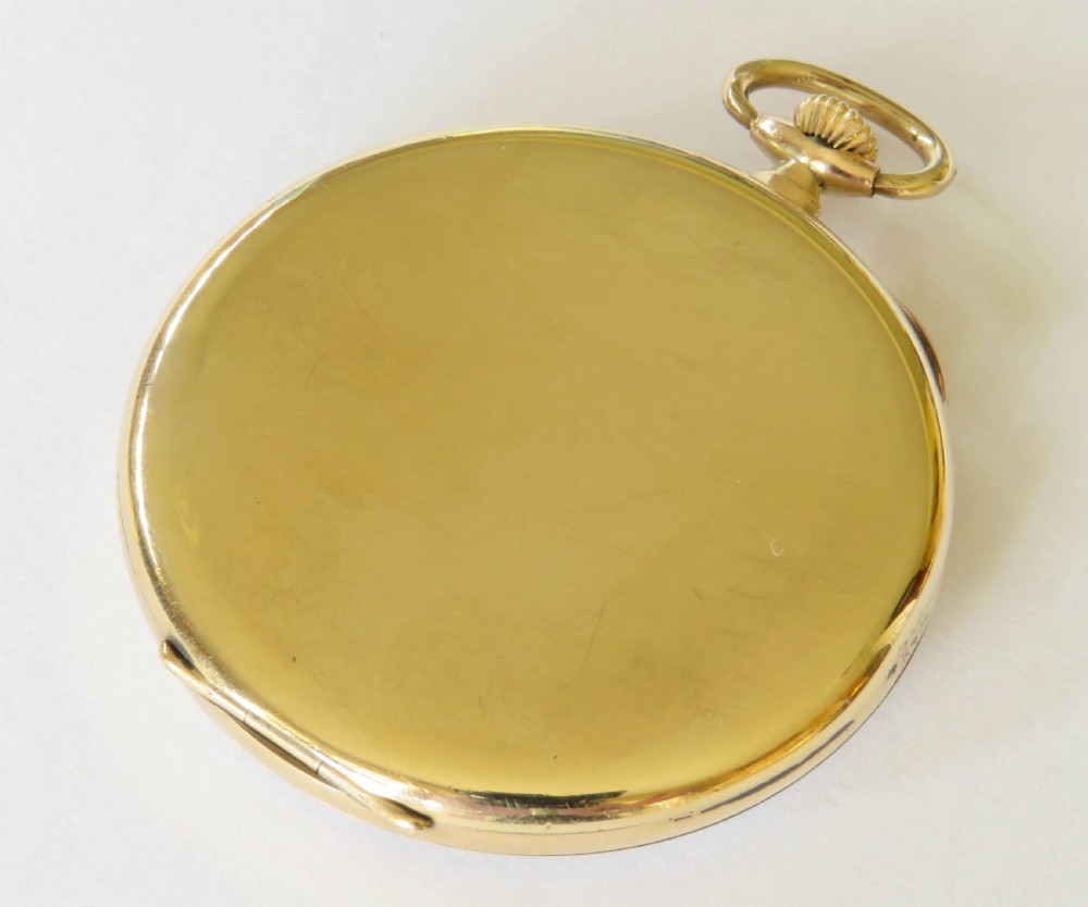 An Art Deco 1920s gold open-face pocket watch by Elkington featuring a textured dial with Arabic numerals. View III