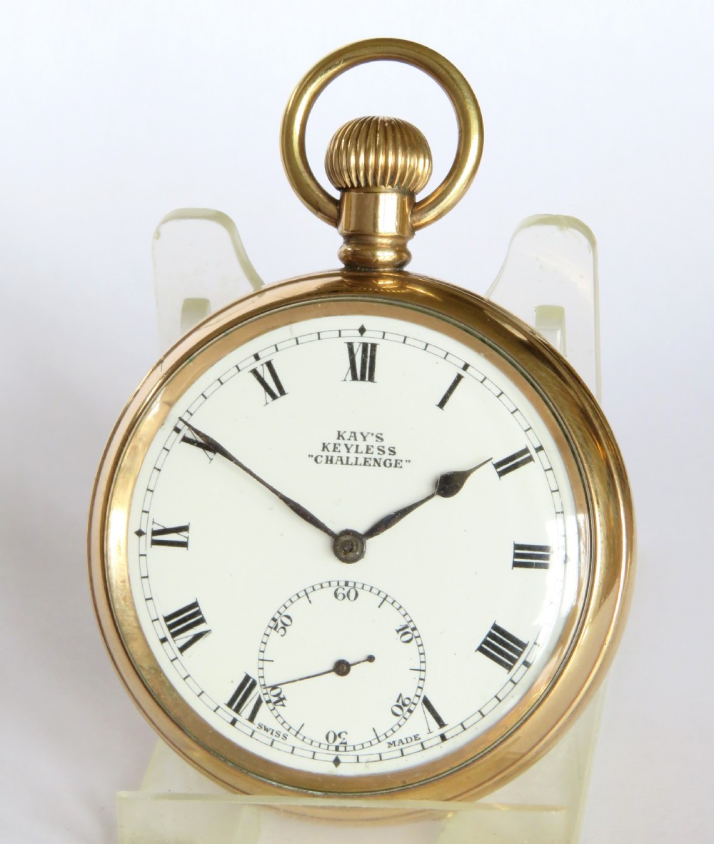 A gold-toned open-face pocket watch featuring a white enamel dial with black Roman numerals and a subsidiary seconds dial. View II