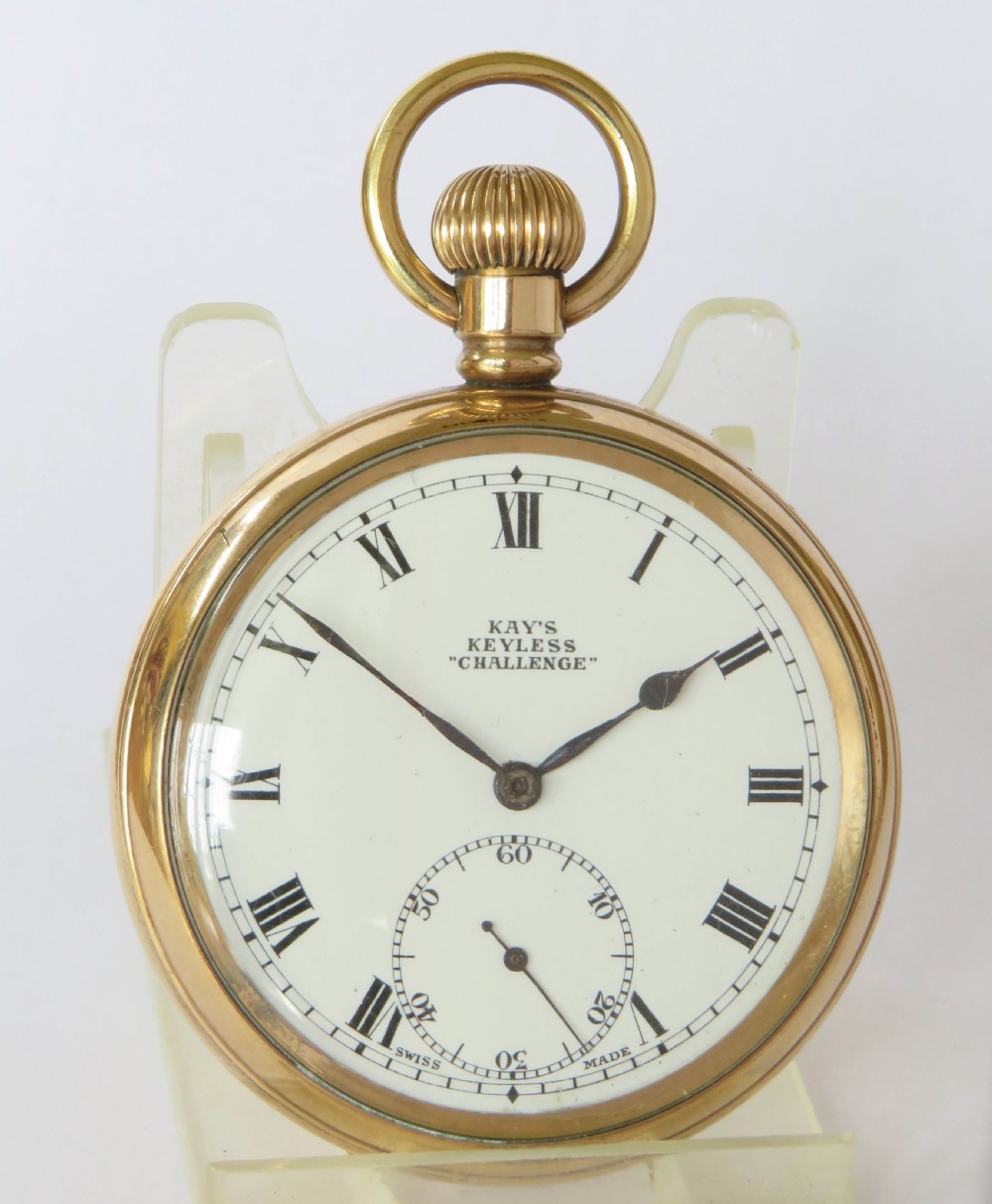 A gold-toned open-face pocket watch featuring a white enamel dial with black Roman numerals and a subsidiary seconds dial. View III