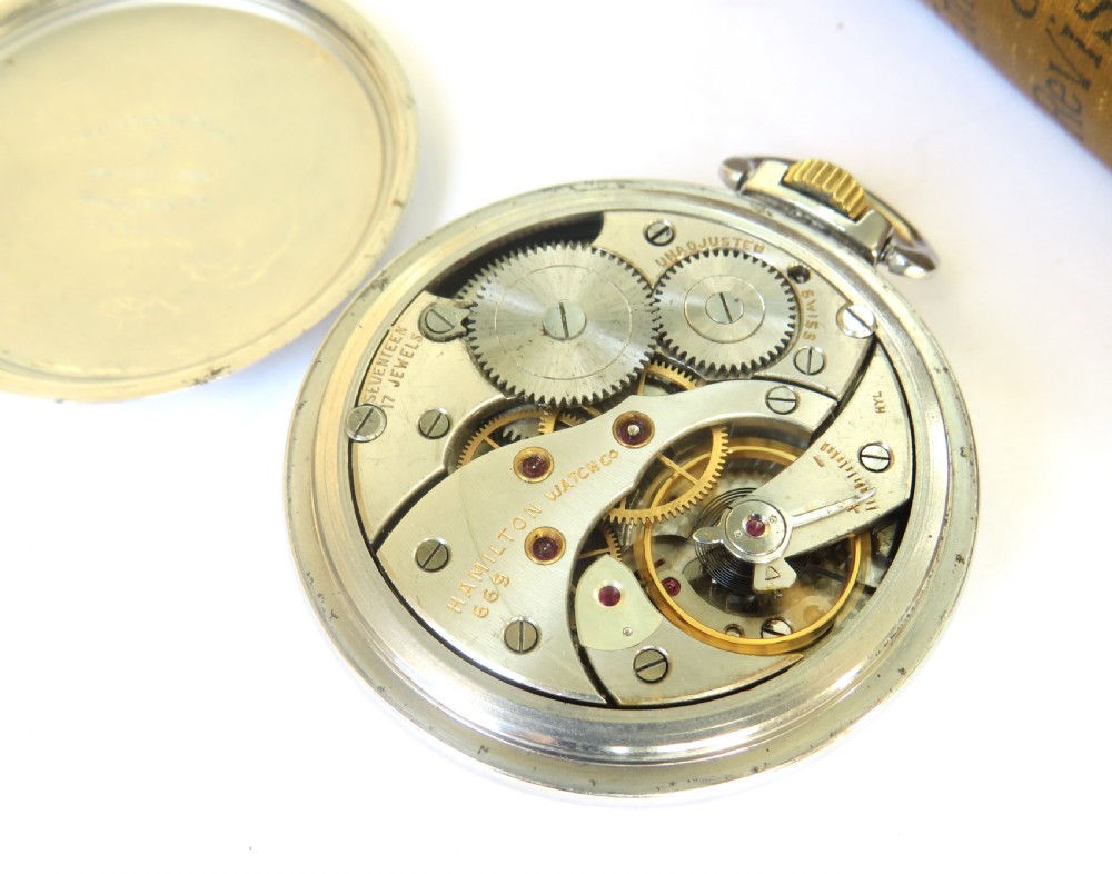 A vintage Hamilton open-face pocket watch featuring a white dial, bold black Arabic numerals, a sub-seconds dial, and a gold-tone crown. View III