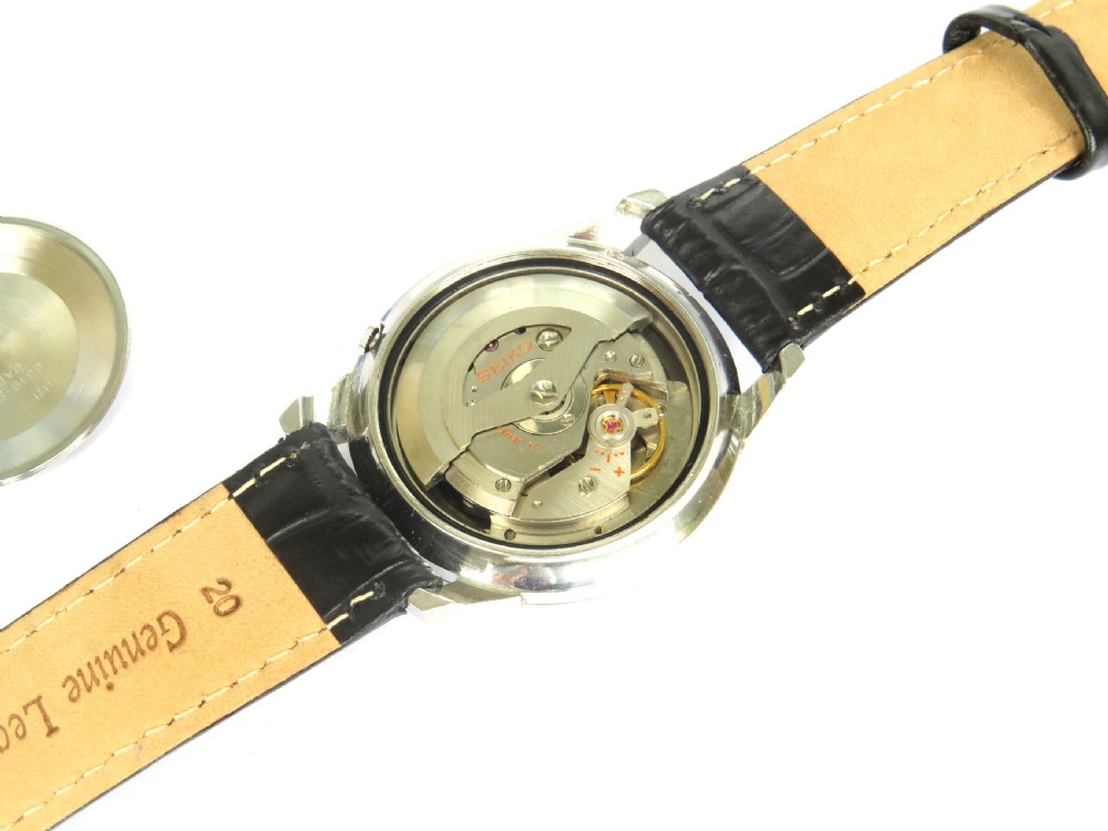 A vintage Seiko Sportsmatic Weekdater automatic wristwatch featuring a round silver dial with a day-date window and a black embossed leather strap. View III