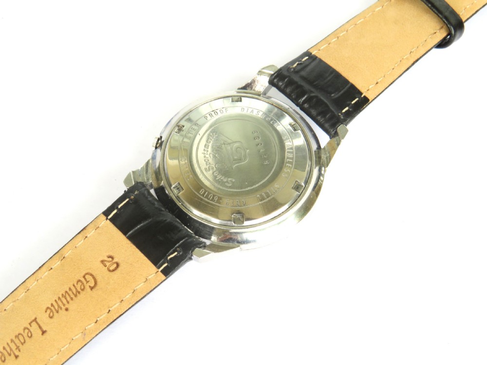 A vintage Seiko Sportsmatic Weekdater automatic wristwatch featuring a round silver dial with a day-date window and a black embossed leather strap. View V