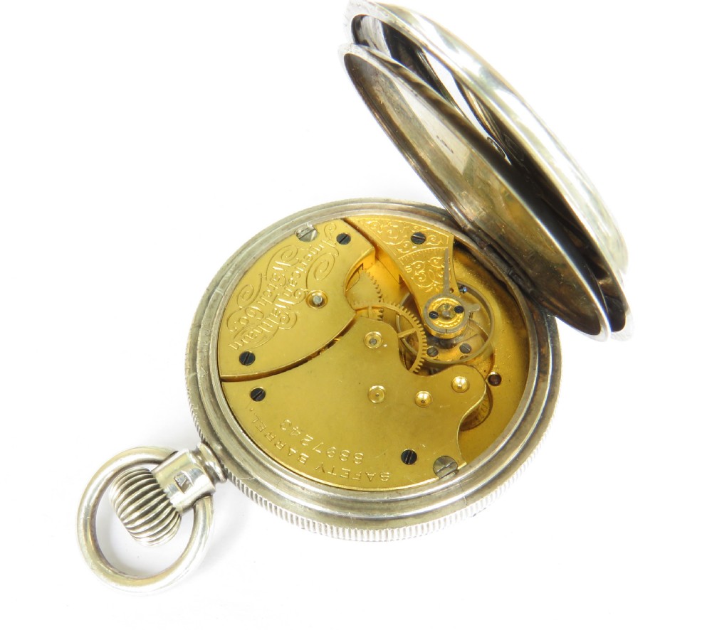 An open-face antique silver pocket watch featuring a white enamel dial with black Roman numerals and steel hands. View IV