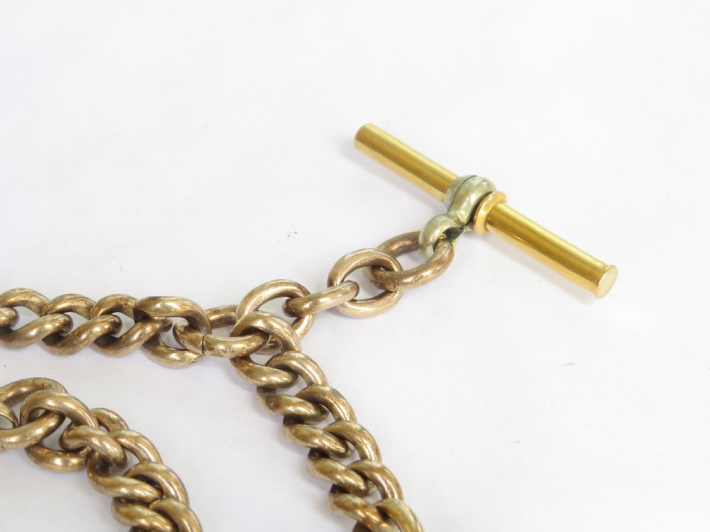 An antique rolled gold double Albert watch chain featuring elongated fetter links, curb chain sections, two swivel clasps, and a central T-bar. View III