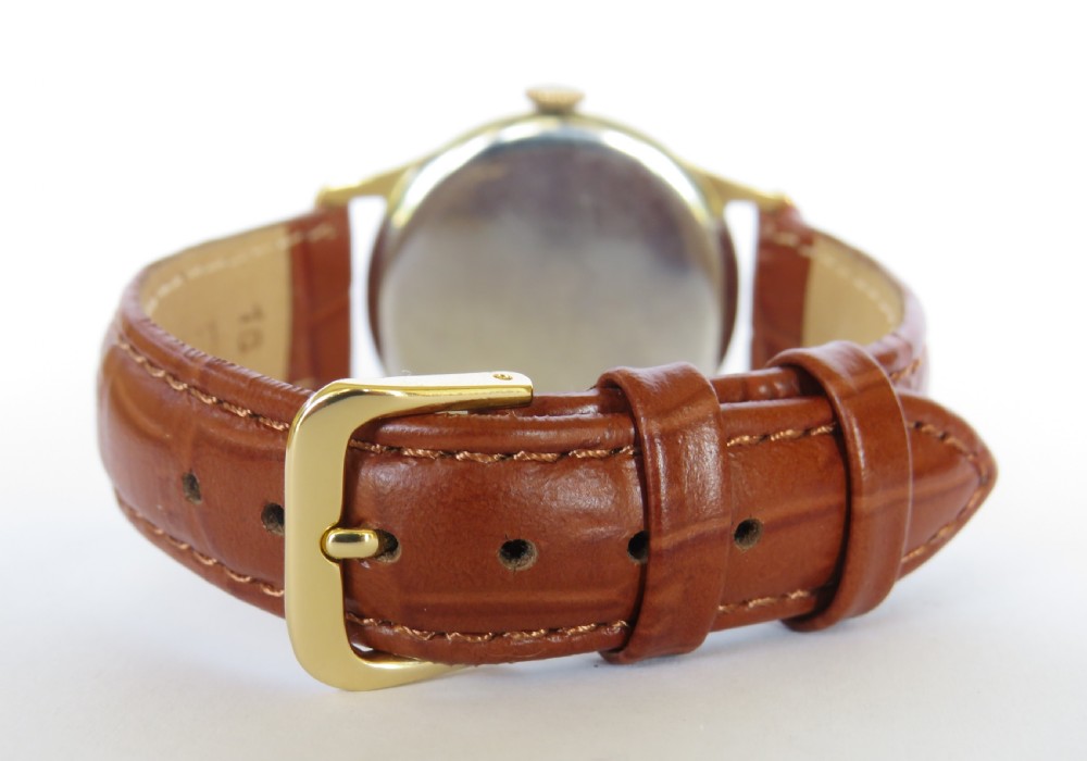 A 1950s gents J W Benson wristwatch with a gold-plated case, cream dial featuring Roman numerals and sub-seconds register, and a brown leather strap. View V