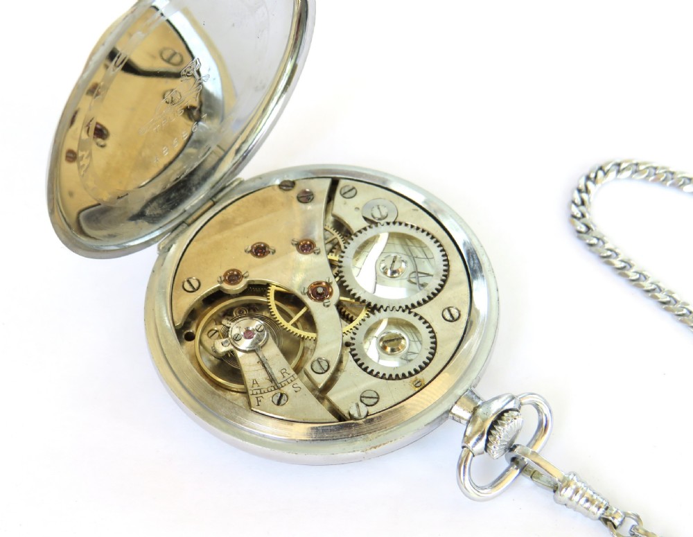 A 1930s open-face Tavannes pocket watch featuring a cream dial with Arabic numerals, a sub-second dial, and a silver-tone curb chain. View III