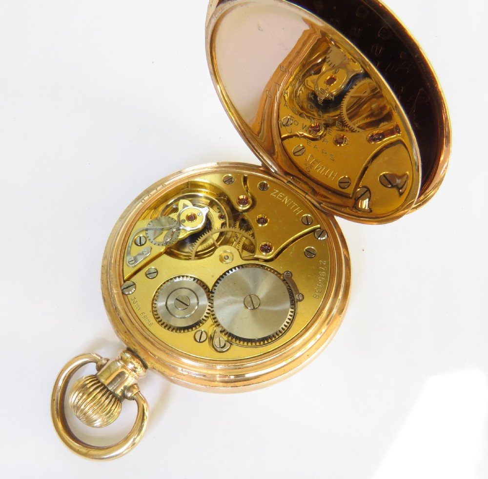 An open-face gold Zenith pocket watch featuring a white enamel dial with black Roman numerals and a small seconds sub-dial. View III