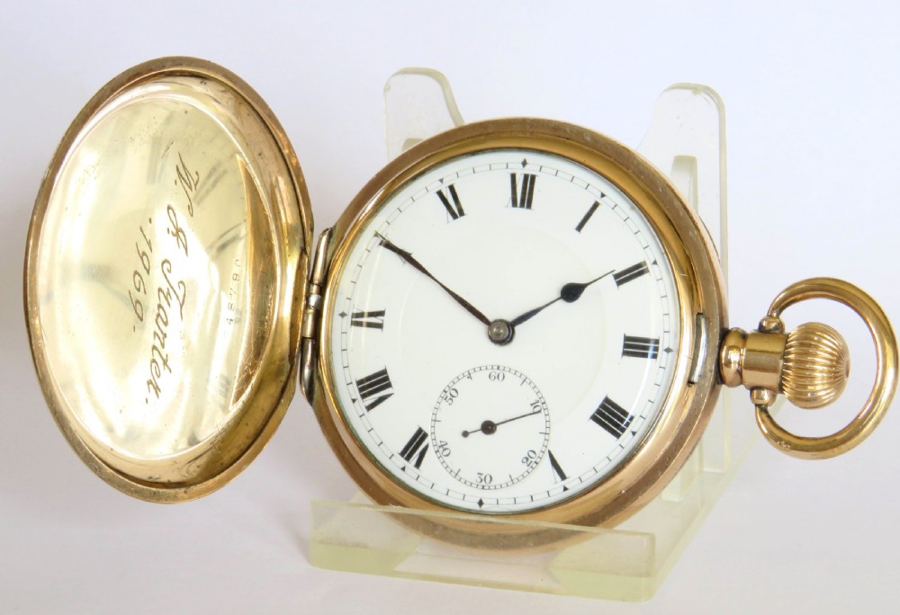 An opened gold antique full hunter pocket watch displaying a white enamel dial with black Roman numerals and a subsidiary seconds dial. View II