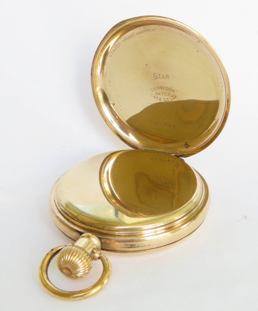 An opened gold antique full hunter pocket watch displaying a white enamel dial with black Roman numerals and a subsidiary seconds dial. View III