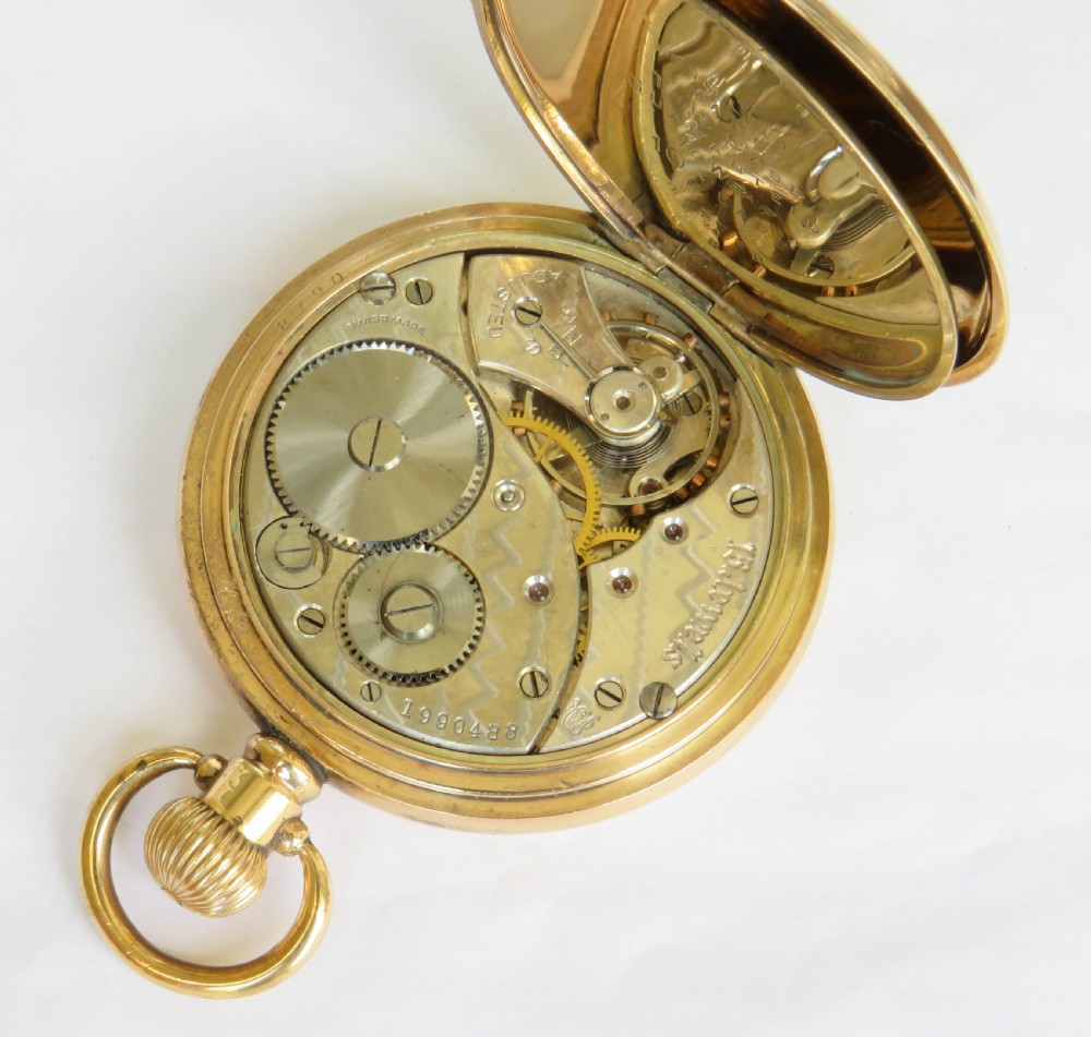 An opened gold antique full hunter pocket watch displaying a white enamel dial with black Roman numerals and a subsidiary seconds dial. View IV