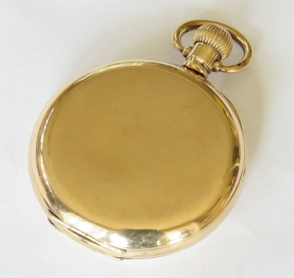 An opened gold antique full hunter pocket watch displaying a white enamel dial with black Roman numerals and a subsidiary seconds dial. View VI