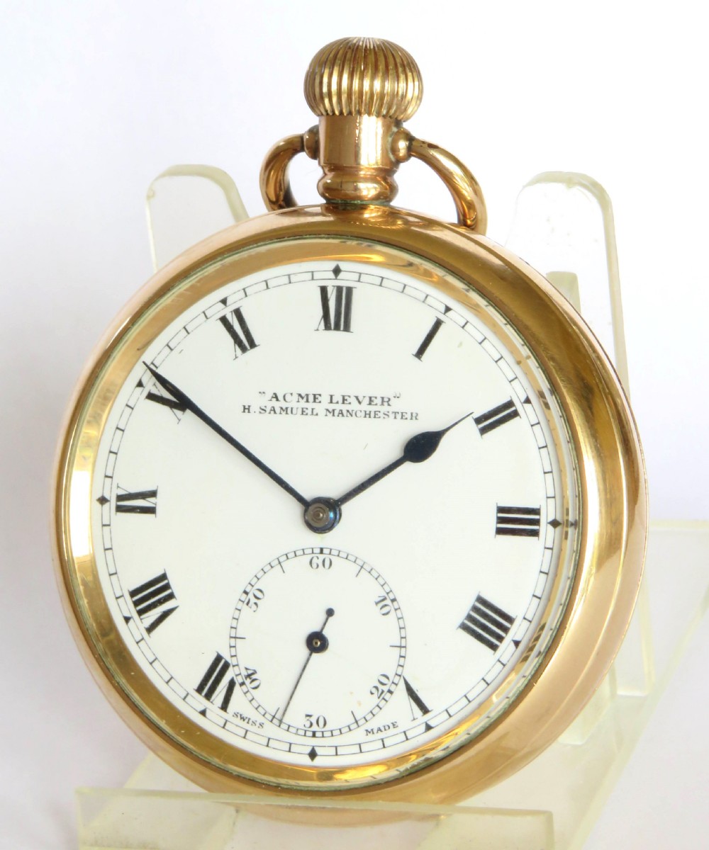 An open-face antique gold-toned pocket watch with a white enamel dial, black Roman numerals, and a subsidiary seconds display. View II