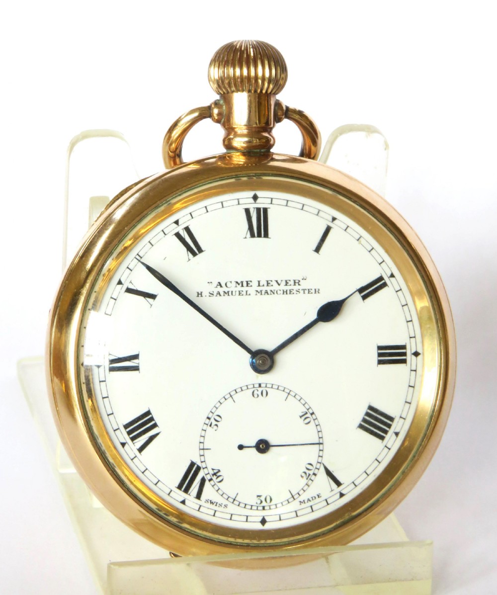 An open-face antique gold-toned pocket watch with a white enamel dial, black Roman numerals, and a subsidiary seconds display. View III