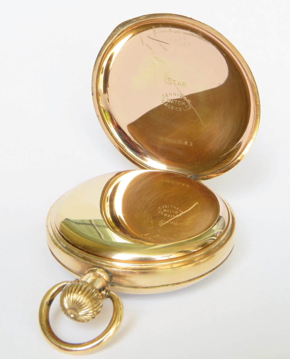 An open-face antique gold-toned pocket watch with a white enamel dial, black Roman numerals, and a subsidiary seconds display. View IV