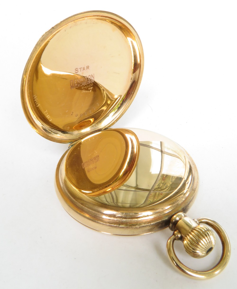 An antique gold full hunter pocket watch shown with its front cover hinged open to reveal a white enamel dial with black Arabic numerals. View III
